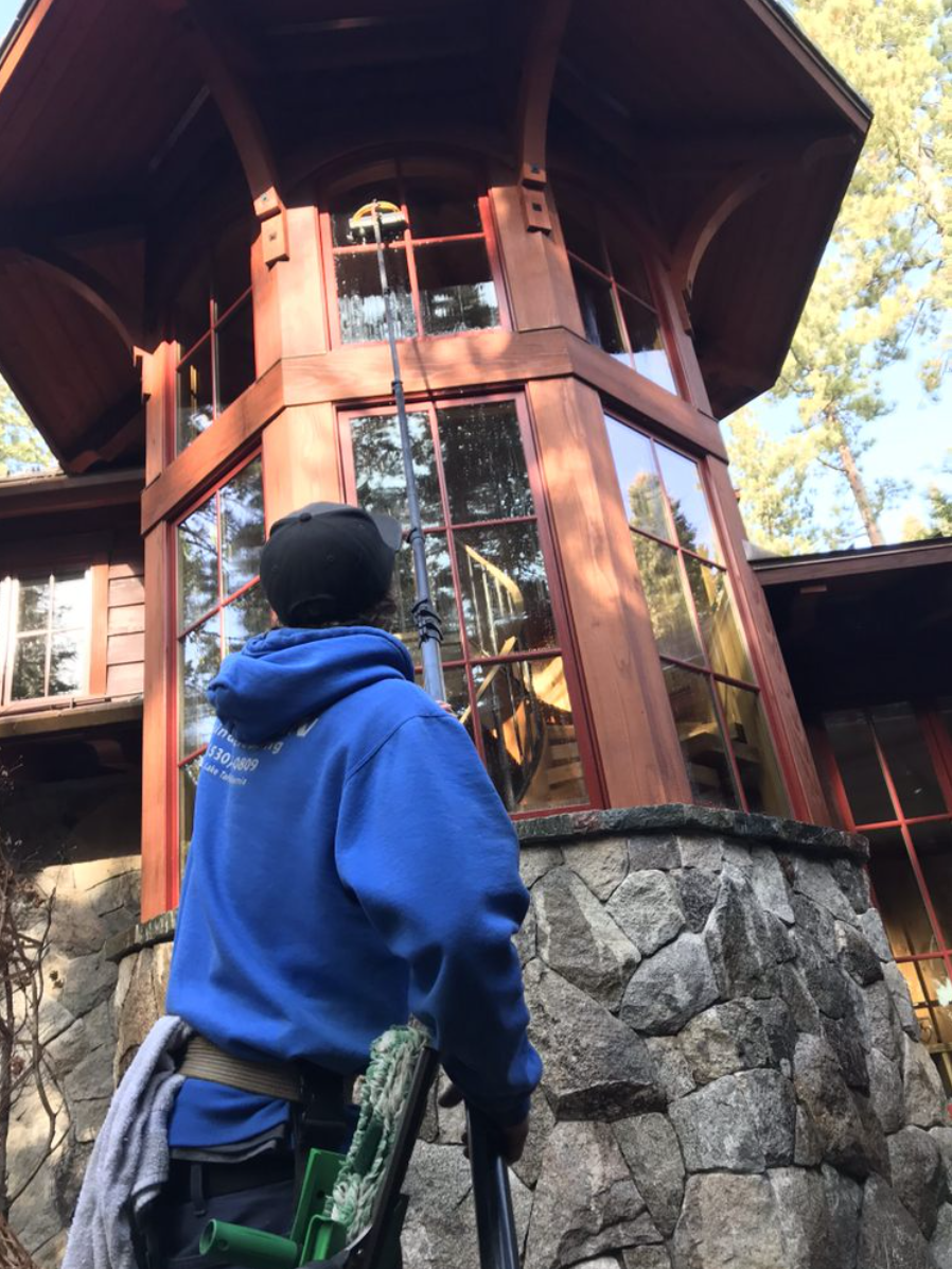 Cleaning tower windows with a water-fed pole